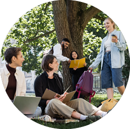 Student with coffee to go and backpack talking to interracial friends in summer park,stock image