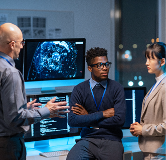 Three intercultural colleagues in formalwear discussing working points at meeting by their workplace in openspace office